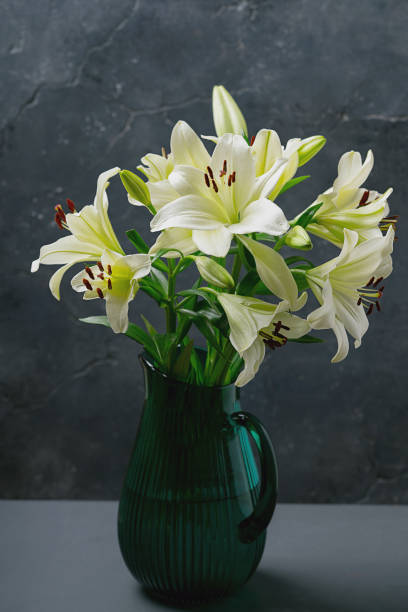 istock elegant white lillies in a green jub 2188885576