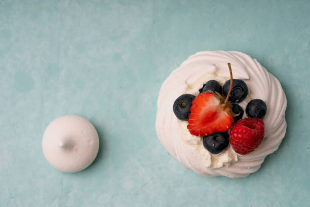 istock Mini Pavlova desert over a blue background 2188885587