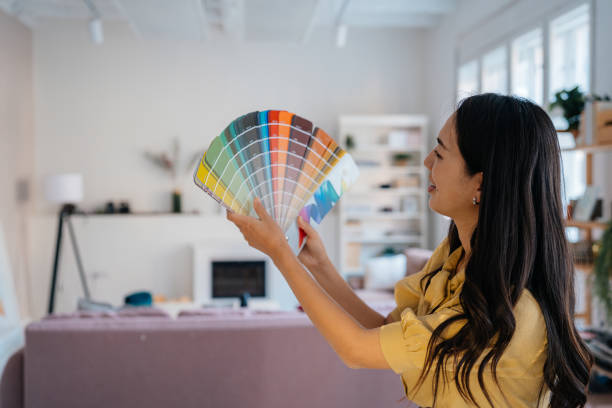 Designer Reviewing Color Palettes in a Modern Workspace