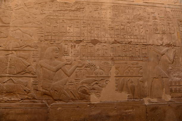 The carved and painted walls within Luxor Temple.