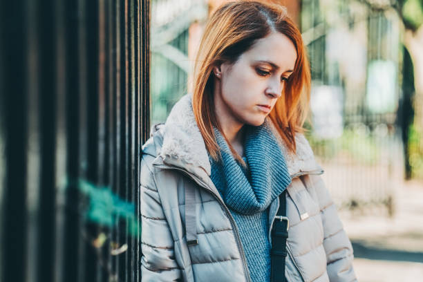 Depressed woman feeling lost in London