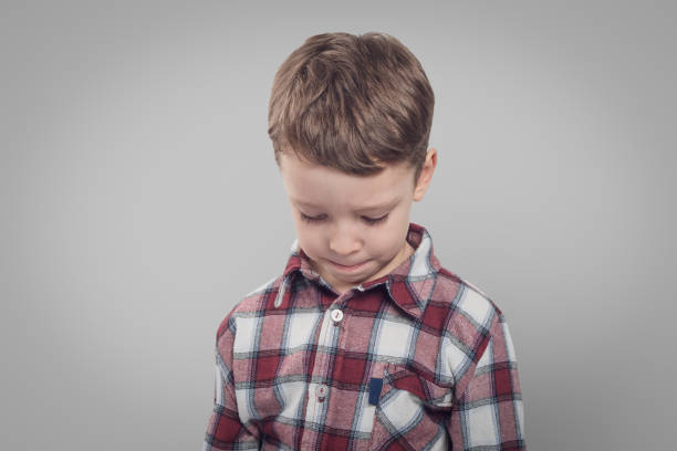 An upset child with a sad expression: Reflecting emotions and vulnerability in difficult childhood moments.