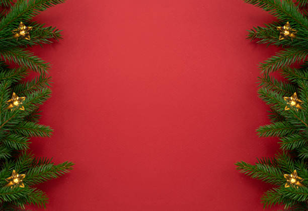 istock Christmas backdrop, empty copy space red background. Fir tree border with lights. Beautiful holiday frame. 2188895492