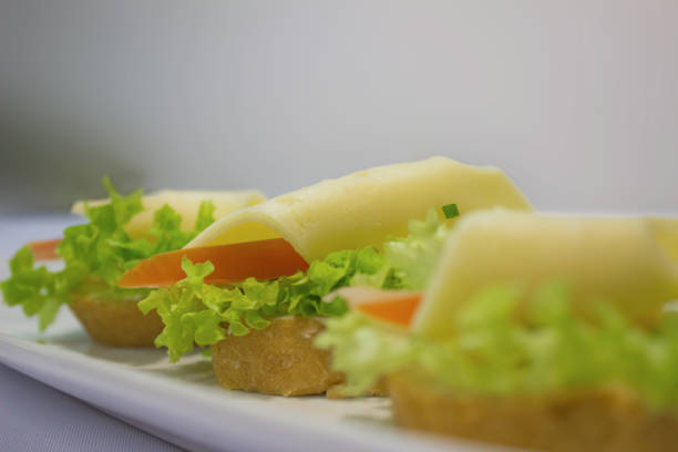 Vegetable dishes with meat, fish and eggs. Snacks, canapes. A variety of snacks. It's time to eat healthy food. Meals by the hour. The concept of a healthy lifestyle.