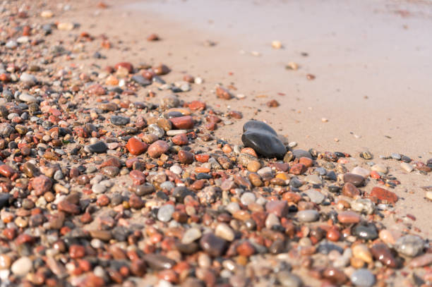 Colorful pebbles on shore of Lake Superior at Presque Isle River Falls Loop in Porcupine Mountains, Michigan, USA