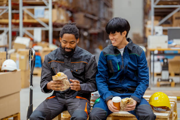 istock Warehouse Workers from Different Cultures Enjoying a Break in the Warehouse 2188900715