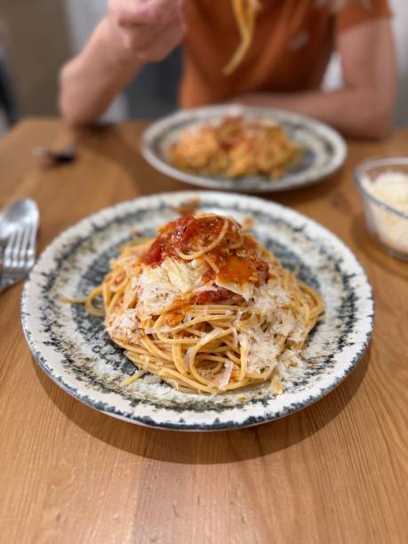 istock Homemade Pasta with Neapolitan Sauce at dinner table 2188901022