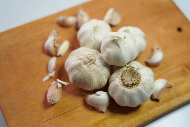 istock garlic on a wood board. closeup image 2188902077