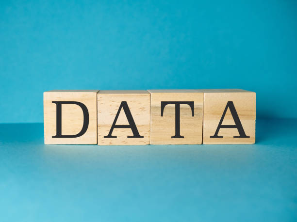 istock Wooden block with the letters DATA is on a blue background 2188903630