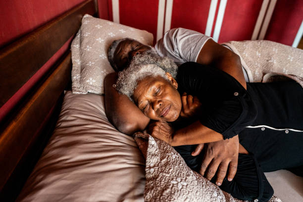 istock Couple sleeping in the bed at home 2188903707