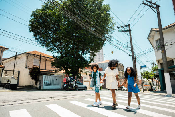 istock Mother and children talking while walking in the street 2188904264
