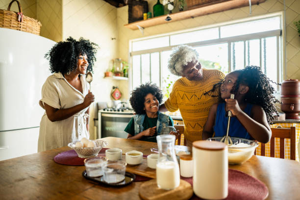 istock Family singing and dancing while baking at home 2188904524
