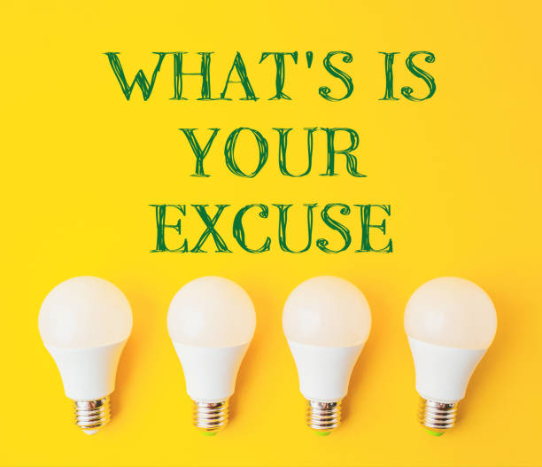 istock Four white light bulbs arranged in a row on a yellow background 2188908639