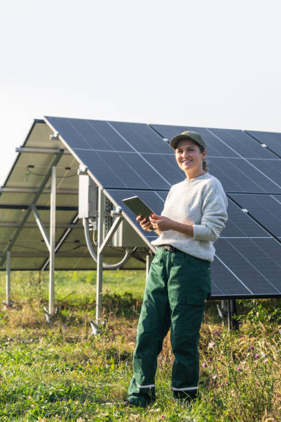 istock Female farmer with digital tablet on a modern farm using solar panels 2188911564
