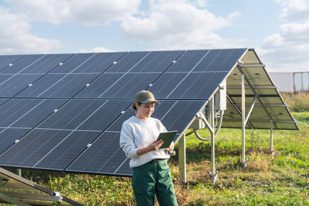 istock Female farmer with digital tablet on a modern farm using solar panels 2188911570