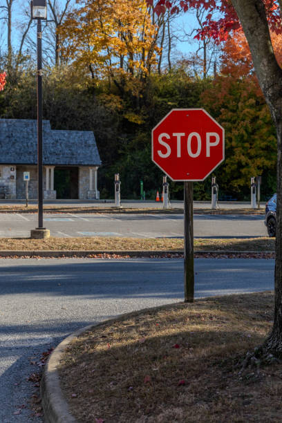 istock A stop sign is on a pole in front of a building 2188912923