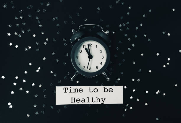 istock Black and white clock with the time of 11:00 on it 2188914579
