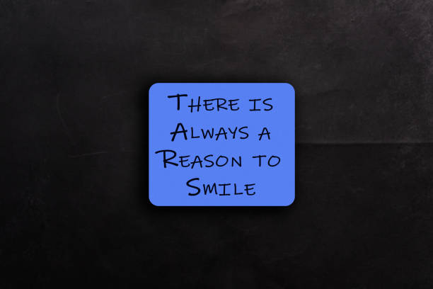 istock Blue sign that says There is always a reason to smile 2188914599