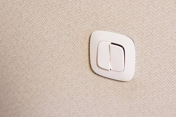 Close up shot of the electrical switch on the wall