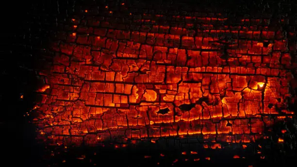 Photo of glowing board, burning wood, background