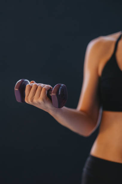 istock Focused Woman Holding Dumbbell During Strength Training Workout in Gym 2188922845