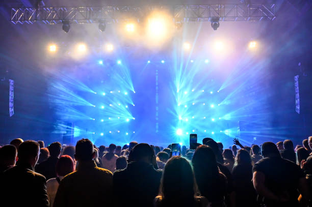 istock Audience cheering at concert and a party 2188927961