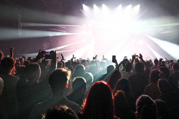 istock Audience cheering at concert and a party 2188928107