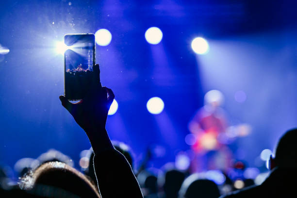 istock Audience cheering at concert and a party 2188928120