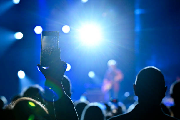 istock Audience cheering at concert and a party 2188928494