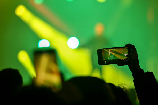 istock Audience cheering at concert and a party 2188928499