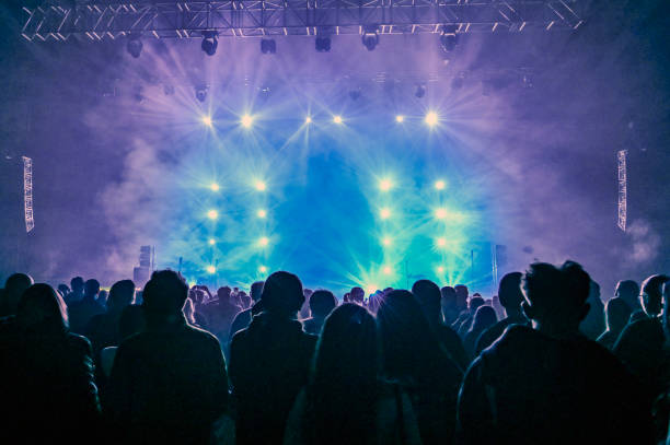 istock Audience cheering at concert and a party 2188928509