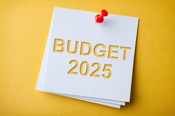 istock Budget 2025 Word in White Sticky Note on Yellow Chardboard Background 2188929388