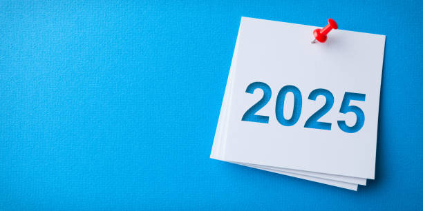 istock White Sticky Note With Happy New Year 2025 And Red Push Pin On Blue Cardboard Background 2188929394