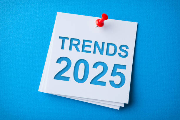 istock Trends 2025 Word in White Sticky Note on Blue Cardboard Background 2188929411