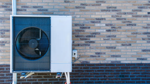 istock Air Source Heat Pump Installed on Exterior Wall During Sunny Day 2188931931