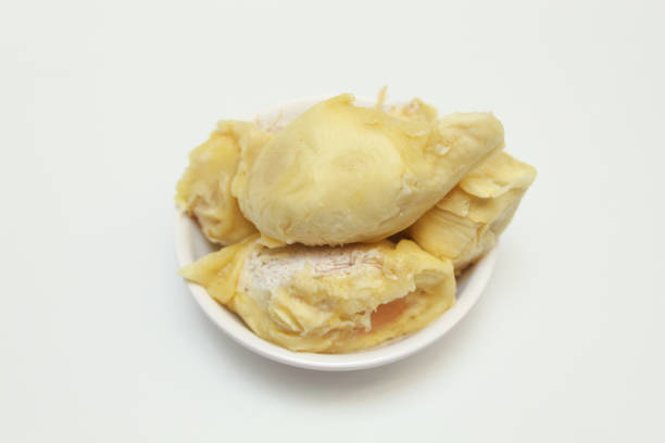 Durian fruit flesh on a white bowl, isolated on white background