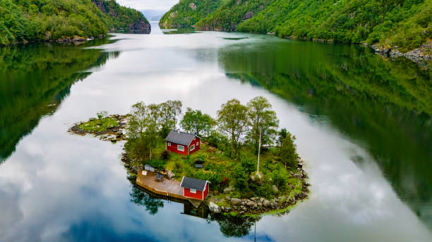 istock Red Cabins on a Secluded Norwegian Island, Lovrafjorden, Norway 2188936725
