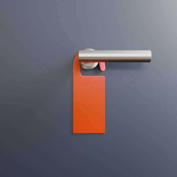 Paper blank label as mockup on door handle at the hotel.