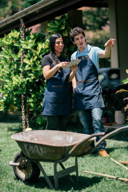istock Young couple planning a garden together 2188940260