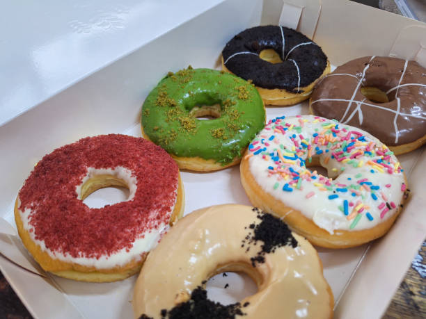istock Assortment of donuts of different flavors in a box. 2188948269