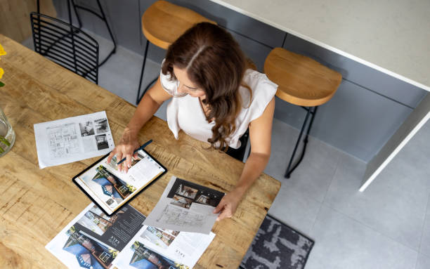 istock Real estate agent listing properties online using a digital tablet 2188950054