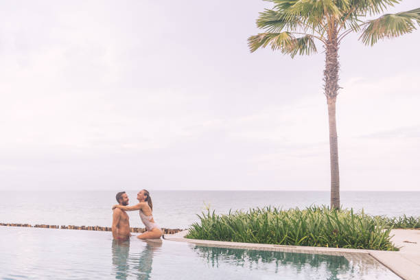 istock Couple Enjoying a Romantic Moment by the Ocean 2188951785