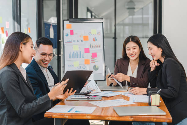 istock Collaborative business meeting with diverse professionals discussing data and strategies. Engaging teamwork in modern office setting enhances productivity and creativity 2188951946
