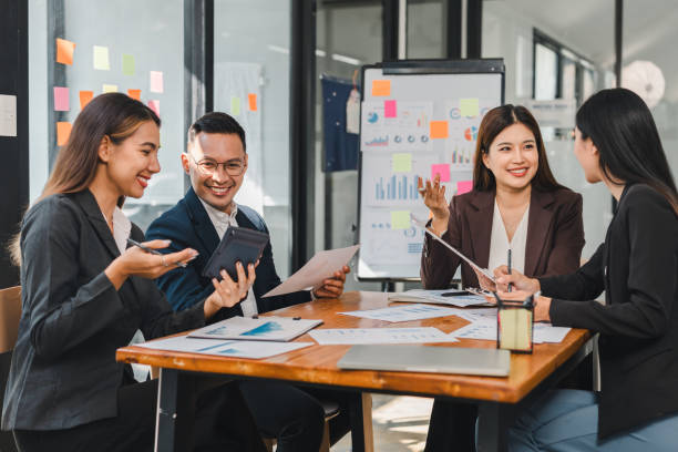 istock Efficient team meeting with professionals discussing strategies and ideas. Engaged expressions and collaborative atmosphere enhance productivity and creativity 2188951974