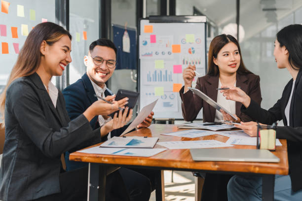 istock Collaborative business meeting with professionals discussing strategies and data analysis. Engaged team members share ideas and insights in modern office setting 2188951983