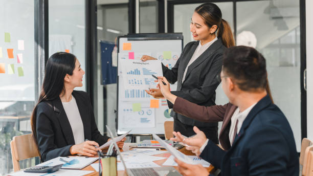 istock business meeting with professionals discussing marketing reports and data analysis. atmosphere is focused and collaborative, showcasing teamwork and strategy 2188952031