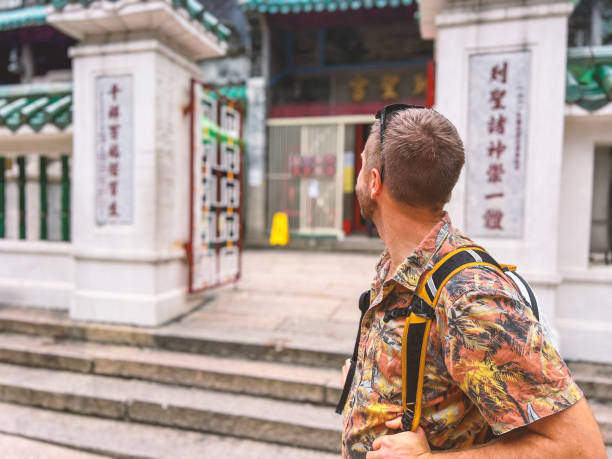 istock Traveler exploring historic temple in urban city backdrop 2188954366