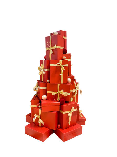 istock red gift boxes adorned with golden bows, stacked in a shape resembling a Christmas tree. Perfect for use in festive or celebratory themes filled with joy and warmth 2188954654