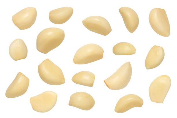 istock Set of peeled garlic cloves isolated on white background 2188961887