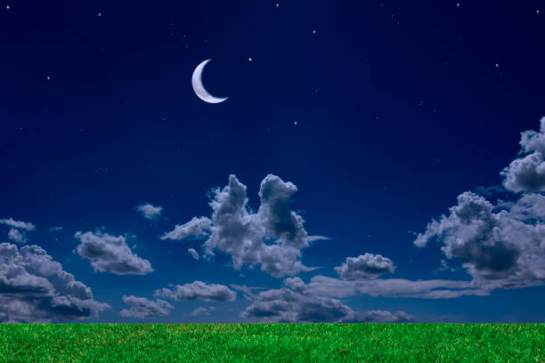 istock Crescent moon rising over the green hill 2188964678